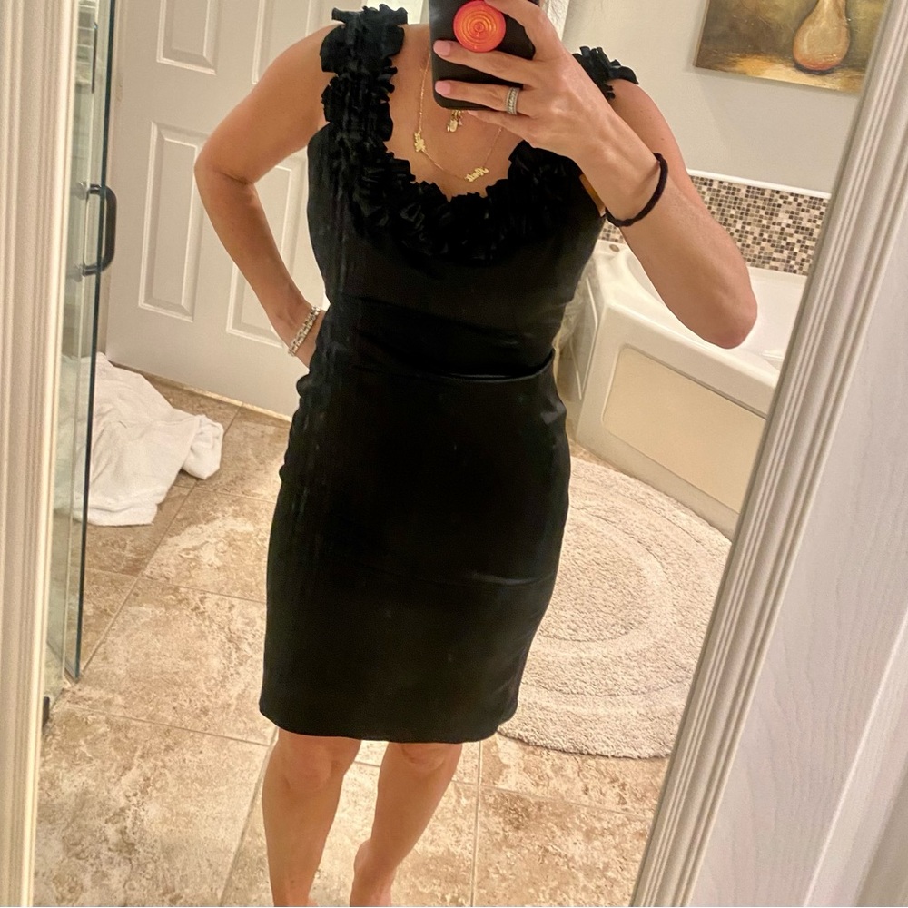 Black cocktail dress with flower/ rose detailing on neck